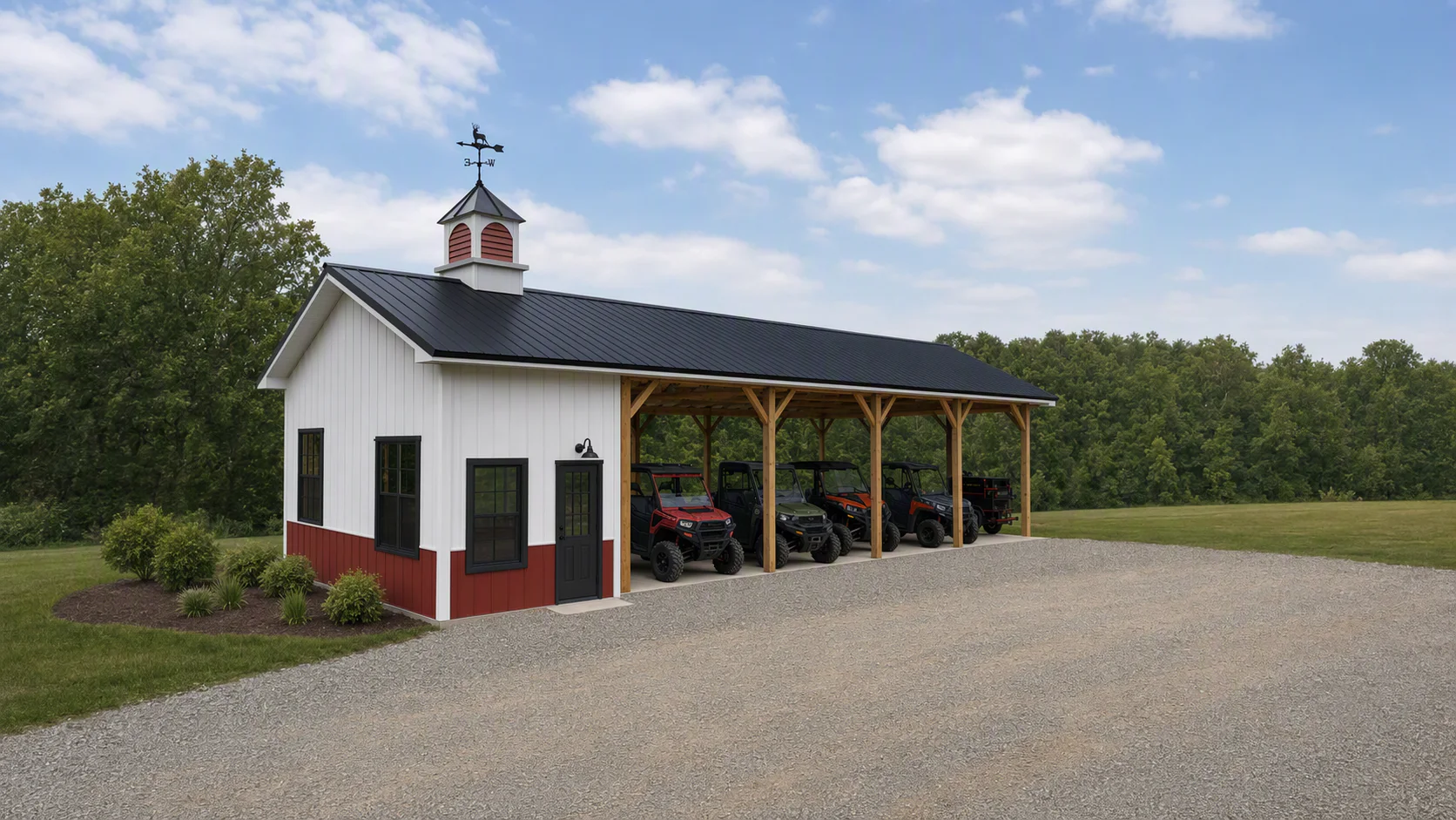 White and red equipment barn with a black metal roof and louvered cupola